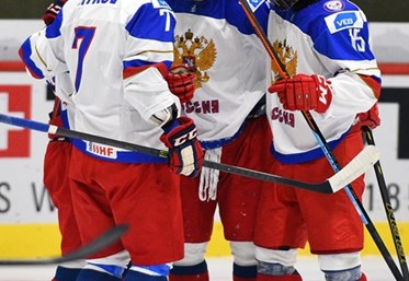 LUCERNE, SWITZERLAND - APRIL 17: Russia's Yegor Rykov #7, Danil Yurtaikin #13, Nikolai Chebykin #8 and German Rubtsov #15 celebrate after a first period goal against Germany during preliminary round action at the 2015 IIHF Ice Hockey U18 World Championship. (Photo by Matt Zambonin/HHOF-IIHF Images)


